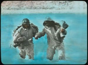 Image of Eskimos [Inuit] Wading in Stream at Cape Sheridan
